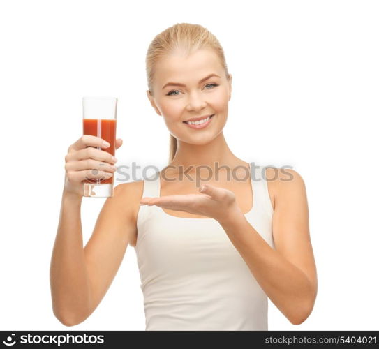 young woman holding glass of tomato juice