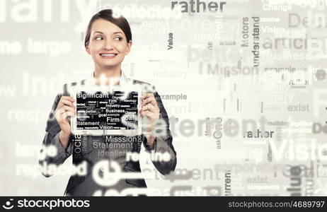 Young woman holding in hands tablet pc. Woman with tablet