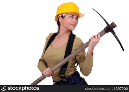 Young woman holding pickaxe