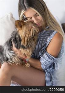 young woman hugging dog