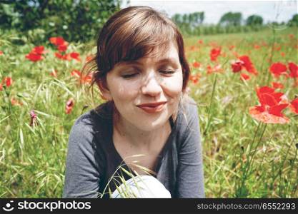 Young woman in a field of flowers