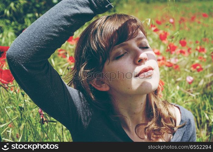 Young woman in a field of flowers