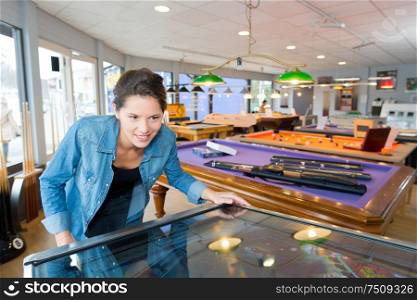 young woman in a game bar