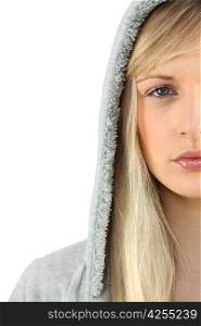 Young woman in a grey hooded sweatshirt