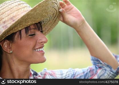 Young woman in a straw hat