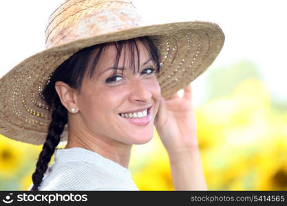 Young woman in a straw hat