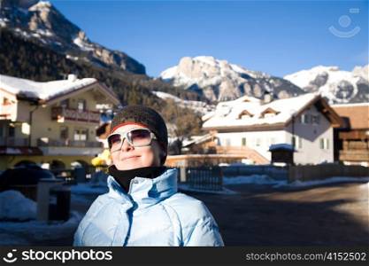 Young Woman In Alps Resort. Winter Travel Series.