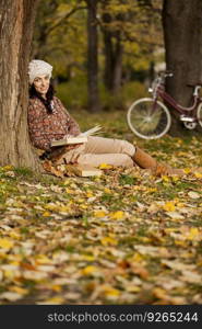 Young woman in autumn park