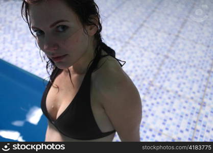 Young woman in basin stair a summer day