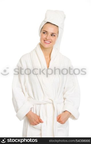 Young woman in bathrobe looking on copy space