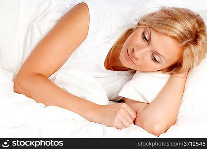 Young woman in bed.