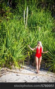 Young Woman in Bikini on a Tropical Sand Beachreleased