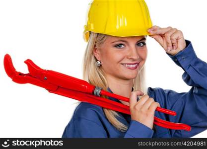 young woman in blue work clothes with tools