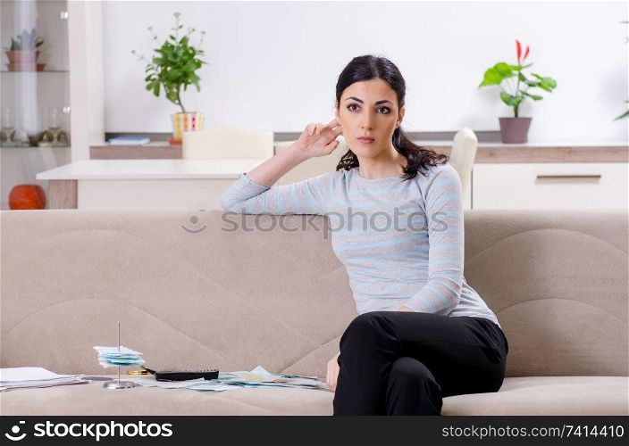 Young woman in budget planning concept 