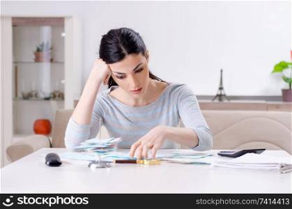 Young woman in budget planning concept