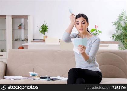 Young woman in budget planning concept 