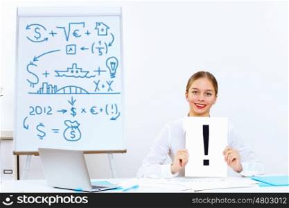 Young woman in business wear generating ideas in office