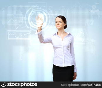 Young woman in business wear with touchscreen technology background