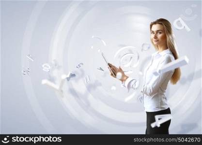 Young woman in business wear with touchscreen technology background