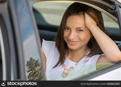 Young Woman in Car on Backseat