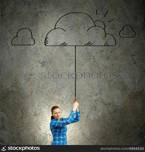 Young woman in casual holding cloud on lead. Weather concept