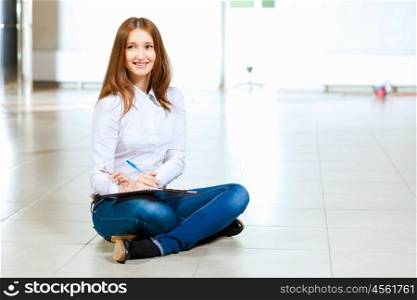 Young woman in casual. Image of young red hair woman in casual wear