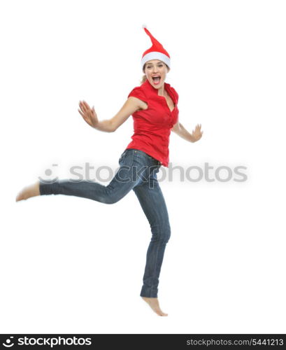 Young woman in Christmas hat jumping