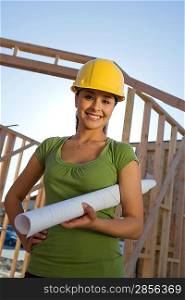 Young woman in construction site