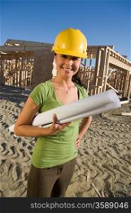 Young woman in construction site