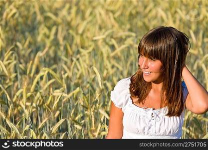 Young woman in corn field enjoy sunset wear white blouse