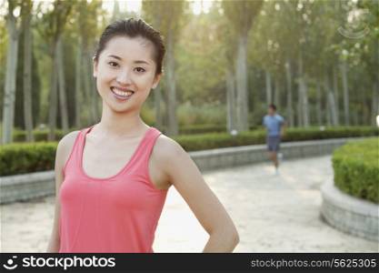 Young Woman in exercise clothing in a Park, Beijing, China