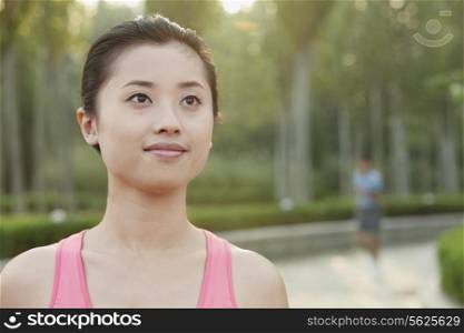 Young Woman in exercise clothing in a Park, Beijing, China