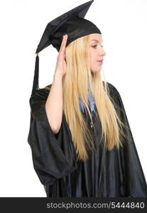 Young woman in graduation gown listening
