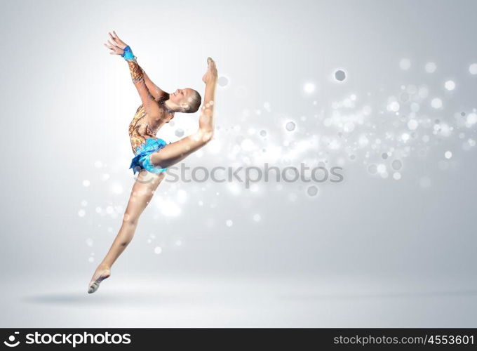 Young woman in gymnast suit posing. Young cute woman in gymnast suit show athletic skill on white background