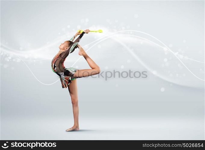 Young woman in gymnast suit posing. Young cute woman in gymnast suit show athletic skill on white background