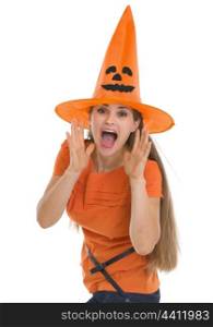 Young woman in Halloween shouting through megaphone shaped hands