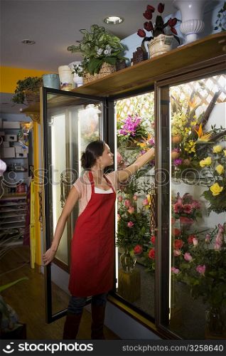 Young woman in her flower shop