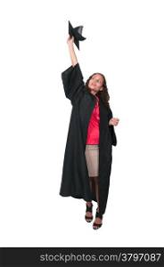 Young woman in her graduation robes throwing her cap