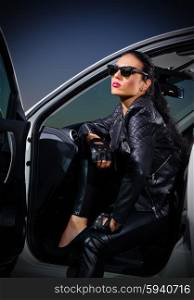 Young woman in leather clothes