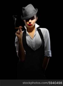Young woman in manly style with cigar isolated