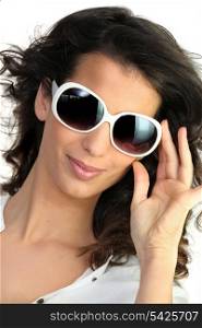 Young woman in oversized sunglasses