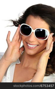 Young woman in oversized sunglasses