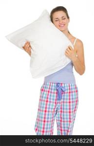 Young woman in pajamas enjoying cosy pillow