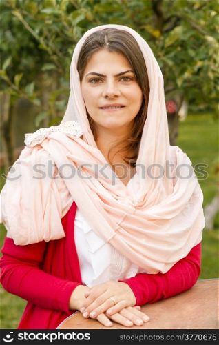 Young woman in pink scarf