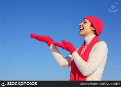 Young woman in red gloves