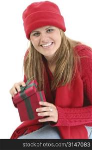 Young Woman in Red Winter Clothes with Gift Box. Shot in studio over white.