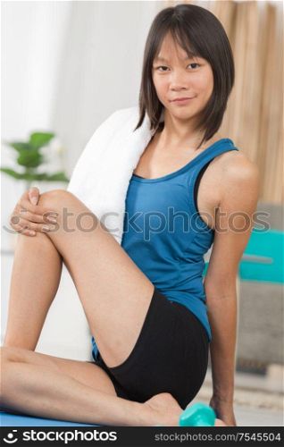 young woman in seated yoga position