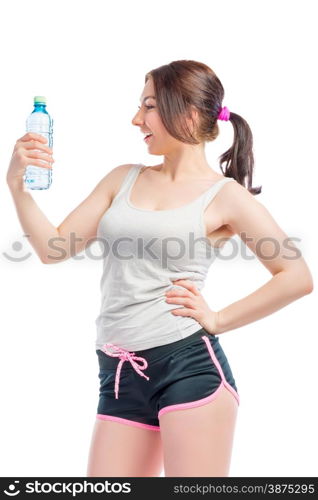 young woman in shorts and a t-shirt with a water bottle