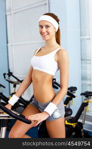 Young woman in sport wear doing sport in gym