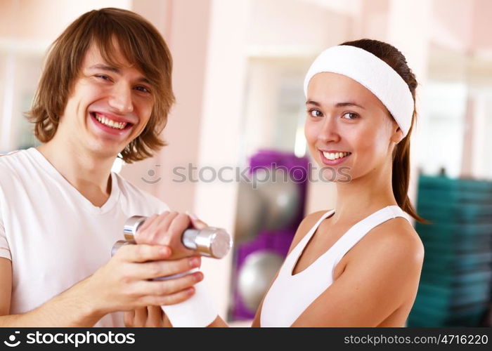 Young woman in sport wear doing sport in gym